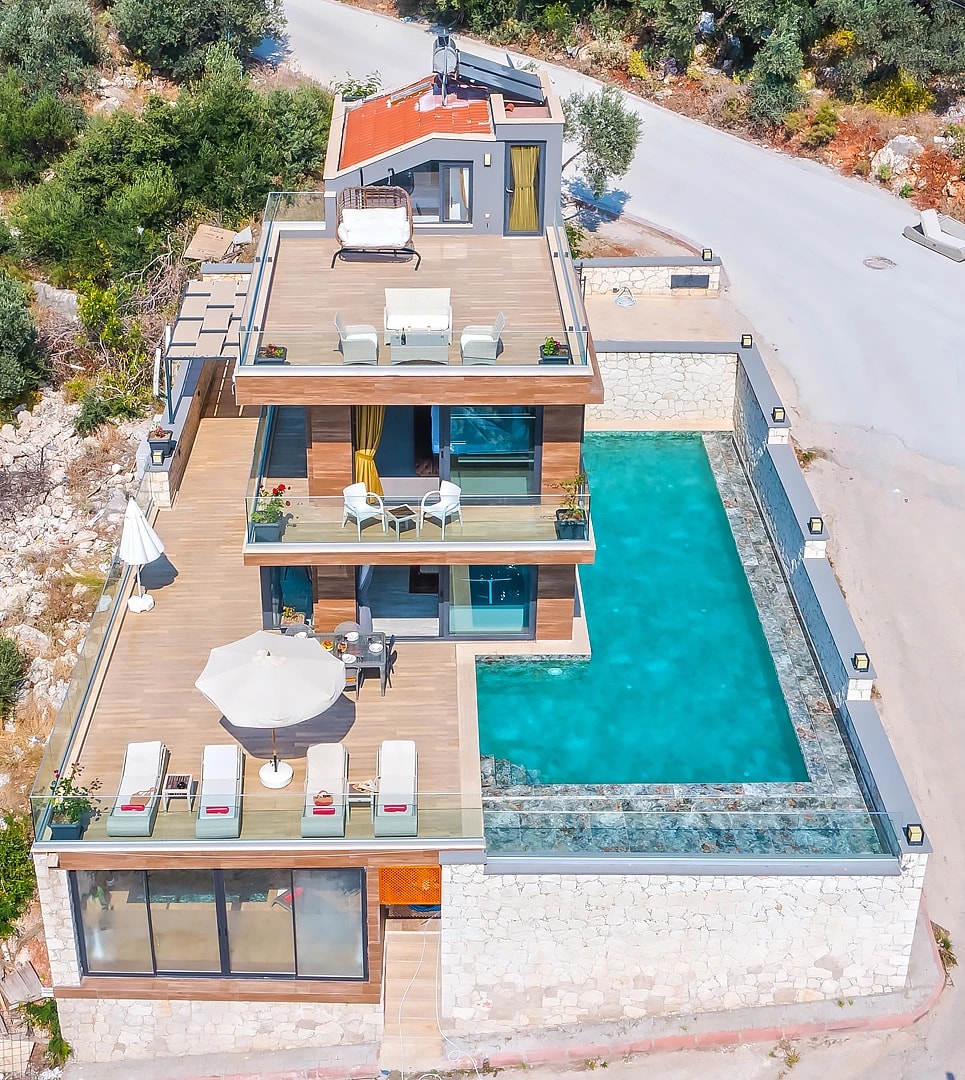 Aerial view of modern villa with private pool, multiple terraces, and premium outdoor living areas.