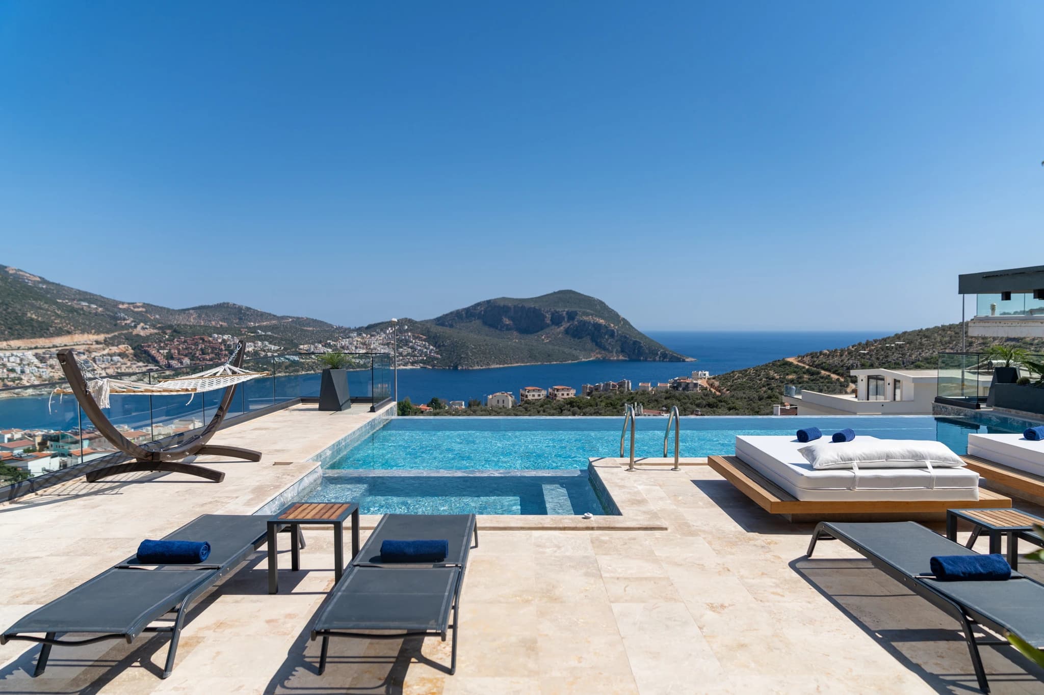 Stunning infinity pool with panoramic sea and mountain views overlooking the Mediterranean coastline.